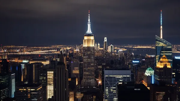 Skyline de Nova York visto do alto à noite com luzes da cidade refletindo no rio